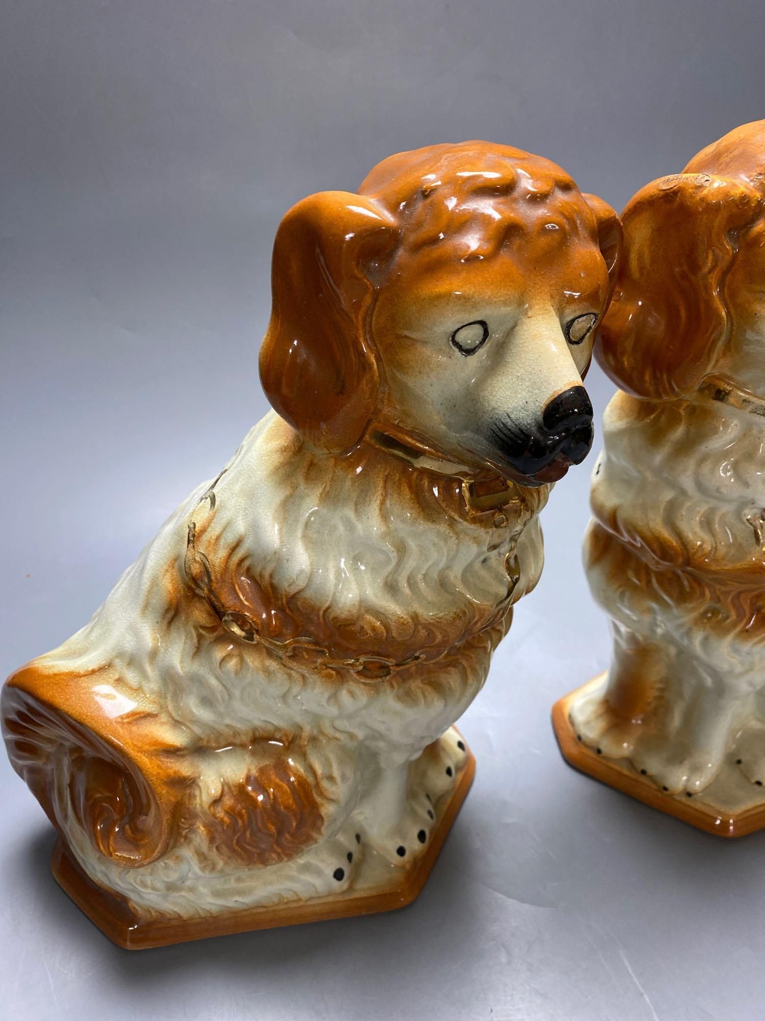 A pair of modern Staffordshire pottery dogs, 33cm